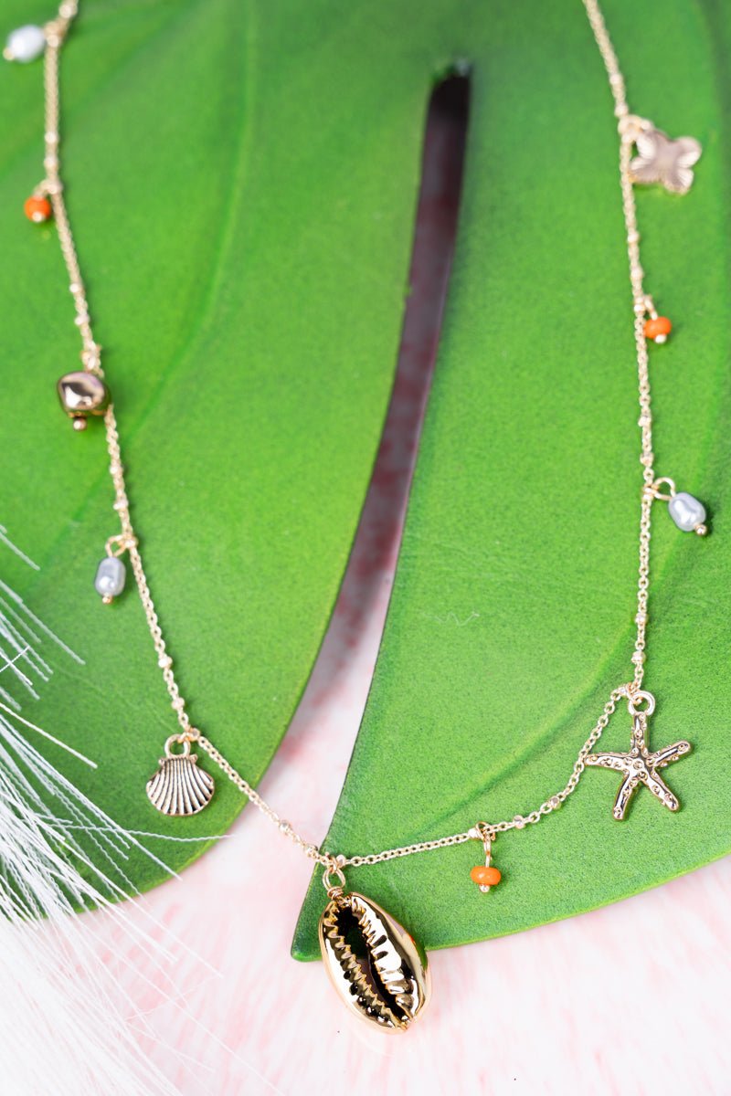 Gorgeous Goldtone Crystal and Pearl Accented Charm Necklace from Crystal Avenue Rockyshore